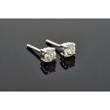 A pair of 18ct white gold and diamond set single stone earstuds,