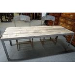 20th century Industrial Design; a metal bound rectangular plank top table, 73cm wide x 182cm long,