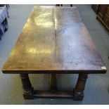 A 17th style oak refectory table, the plank top on turned supports, united by 'H' stretcher,