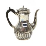 A Victorian silver coffee pot, of oval baluster form, with partly spiral fluted decoration,