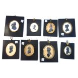 A quantity of silhouette pictures, including a coloured picture of a gentleman, circa 1820,
