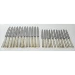 Twelve table knives, having loaded silver handles and with later replacement steel blades,