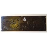 A 17th century oak panel, relief carved as opposing birds, formerly the front panel of a bible box,