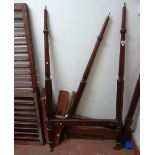 A 19th century child's/dog's mahogany four poster bed, with arch canopy and turned supports,