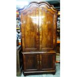 An 18th century Dutch inlaid mahogany floor standing corner cupboard,