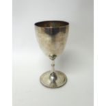 A Victorian silver large trophy goblet, decorated with an engraved band to the rim and to the foot,