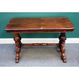 A Victorian rosewood centre table with round rectangular top on pair of carved columns and four