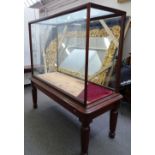 A large glazed mahogany framed free-standing museum display cabinet,