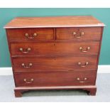 A George III mahogany chest of two short and three long graduated drawers, on bracket feet,