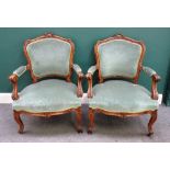 A pair of late 19th century French walnut fauteuils,