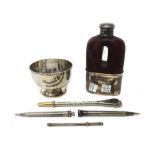 A George IV silver mounted partly leather covered glass spirit flask, with a pull-off beaker base,