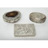 A mid 18th century silver mounted brown agate cartouche shaped hinge lidded snuff box, gilt within,