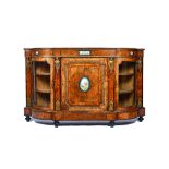 A Victorian gilt metal mounted figured walnut credenza, with ceramic mounted central panel door,