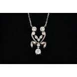 A diamond pendant necklace, the front in an openwork foliate design,