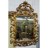 A 19th century gilt framed wall mirror with pierced acanthus frame about the rectangular mirror