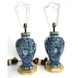 A pair of Dutch Delft tin glaze vases, converted to table lamps, circa 1740,