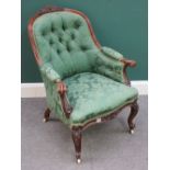 A Victorian walnut framed tub back easy armchair, with serpentine seat and scroll supports,