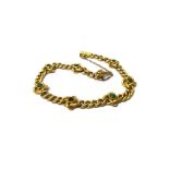 A gold and turquoise set curb link bracelet,