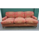 A George Smith style 20th century three seat sofa, with hump back on turned mahogany supports,
