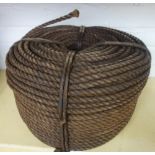 A coil of tarred hemp rope, 40cm diameter.