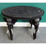 A 19th century Anglo Indian Coromandel Coast carved ebony oval occasional table,