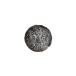 A circular iron medallion, possibly Ancient,