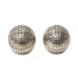 A pair of late Victorian silver pepperettes, each modelled as a ball,