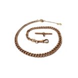 A gentleman's 9ct gold graduated curb link watch Albert chain, fitted with a 9ct gold swivel,