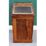 An early 19th century rosewood Davenport, the slide top with fitted interior,