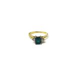 A gold, synthetic emerald and diamond three stone ring,