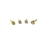 A pair of gold and diamond single stone earstuds, each claw set with a circular cut diamond,