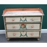 A 19th century Continental later painted pine chest of three long drawers, on turned feet,