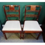 A matched set of six Regency inlaid mahogany dining chairs,