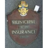 Municipal Mutual Insurance; a metal and enamel decorated hanging double sided sign, of shield form,