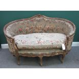 A Louis XV style gilt framed tub back sofa, on scroll supports, 162cm wide x 104cm high.