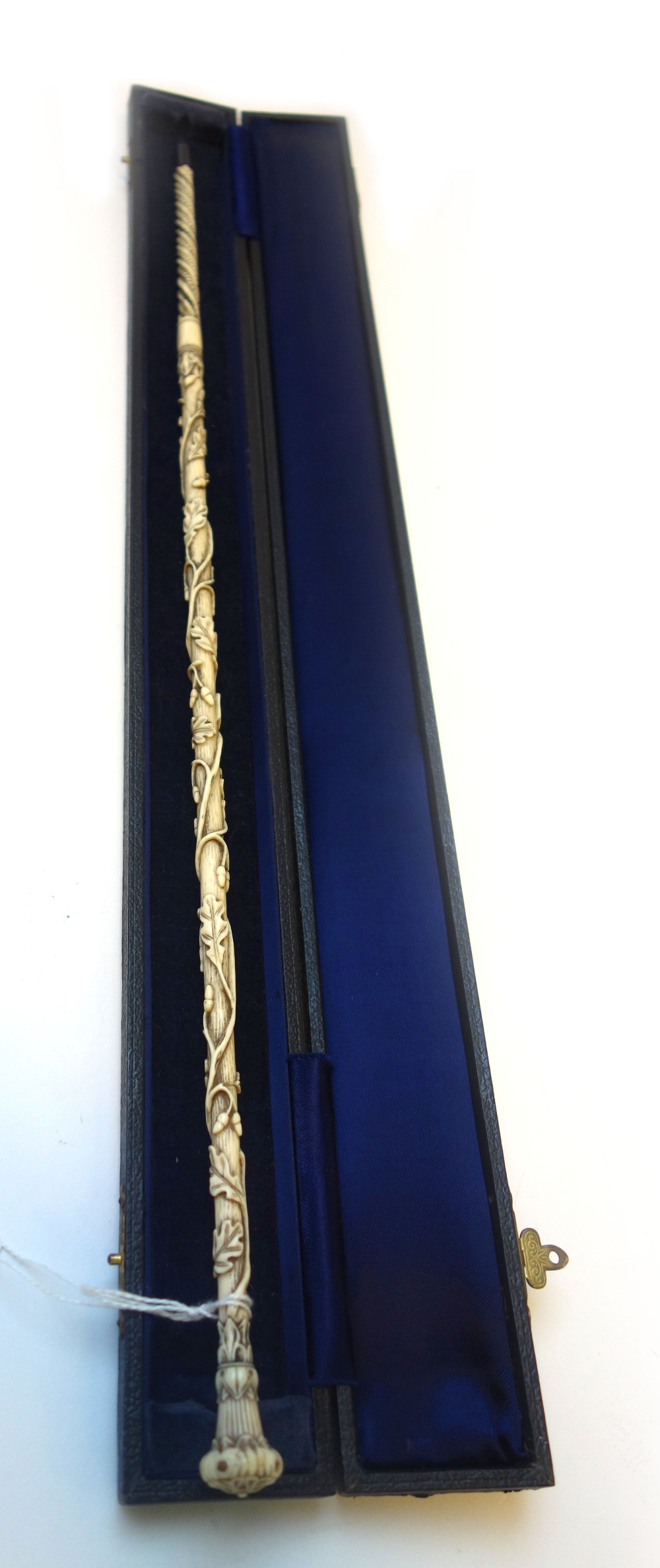 An ivory conductors baton, 19th century, intricately carved all over with vines, - Image 2 of 3