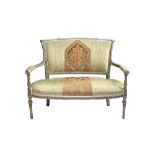 A Louis XVI style green painted open arm sofa, with bow seat on tapering turned supports,