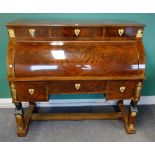 An Empire ormolu mounted mahogany cylinder bureau with three drawers over fitted interior and three