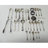 Silver, comprising; two napkin rings, four pairs of sugar tongs, a sugar sifting spoon,