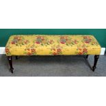 A rectangular footstool on 19th century fluted mahogany supports,