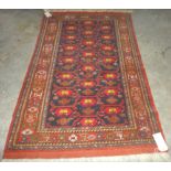A Beshir rug, the black field with three columns of madder flowerheads connected by vines,