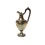 A George III silver hot water jug, of oval form, decorated with beaded rims, raised on an oval foot,