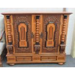 A 19th century German oak and fruitwood side cabinet,