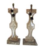 A pair of cream painted terracotta table lamps, early 20th century and later,