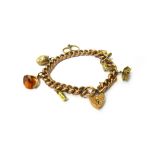 A gold decorated curb link bracelet, on an engraved heart shaped padlock clasp, detailed 9 C,