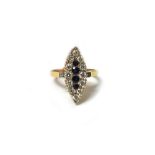A gold, sapphire and diamond set marquise shaped cluster ring,