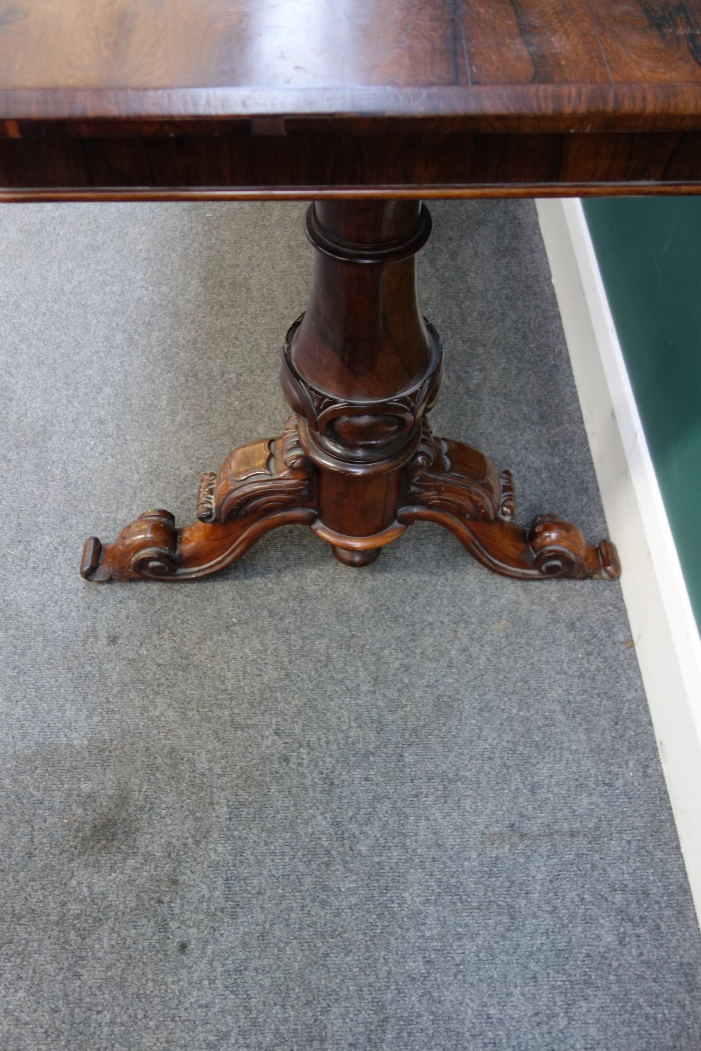 A Victorian rosewood centre table with round rectangular top on pair of carved columns and four - Image 3 of 4