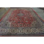 A Mahal carpet, Persian, the madder field with a pale indigo diamond, fawn spandrels,