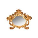 A 19th century Italian gilt framed mirror, with shell crest and winged cherub mounts,