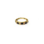 A 9ct gold, sapphire and diamond nine stone half hoop ring,